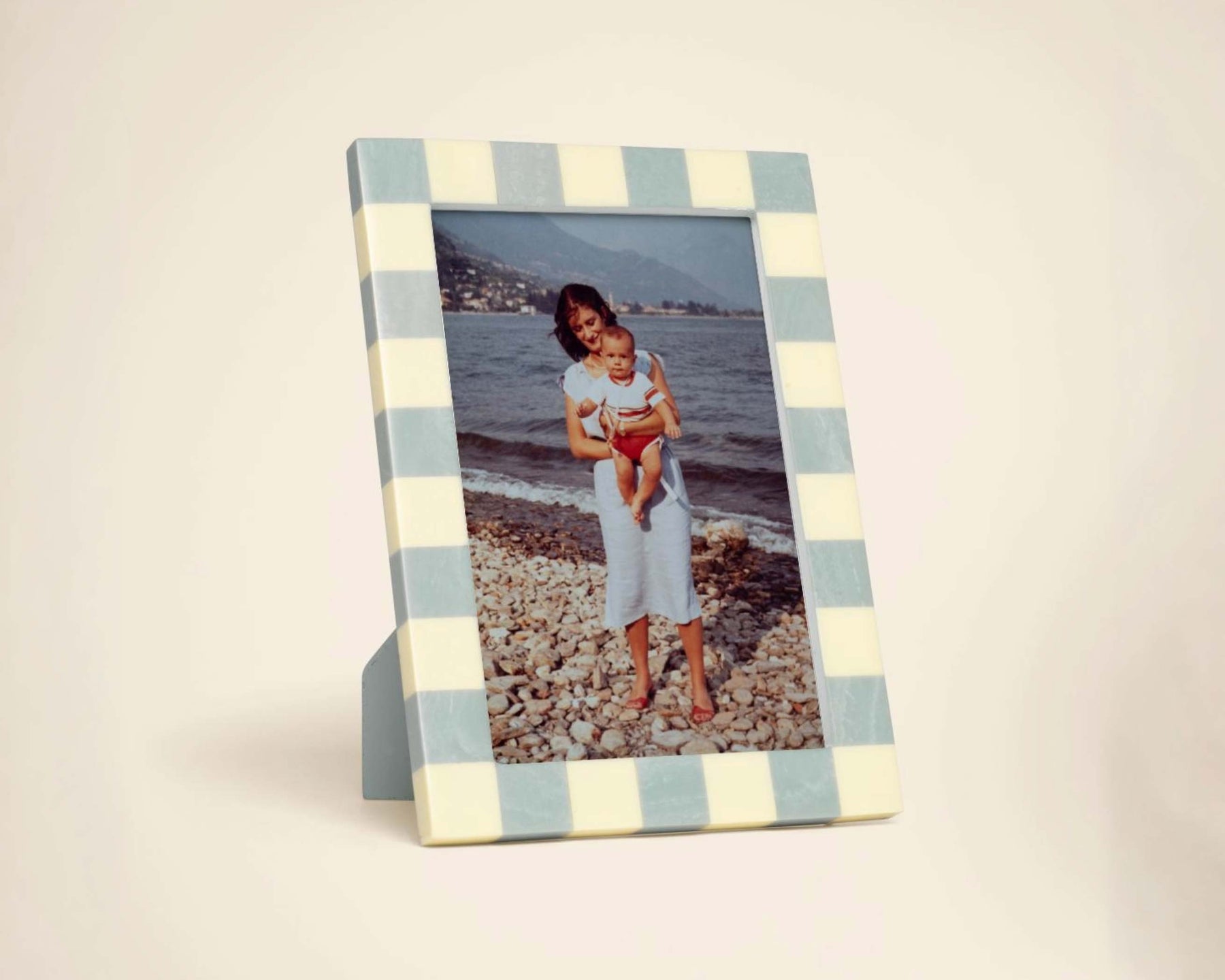 Family photographs from several generations displayed in simple oak frames