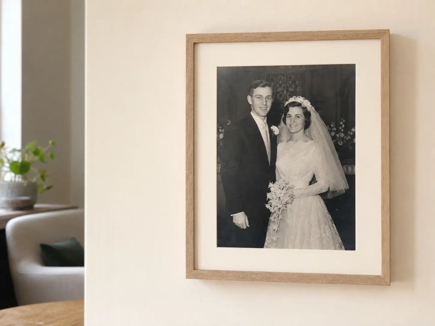 A restored wedding photograph in an oak frame